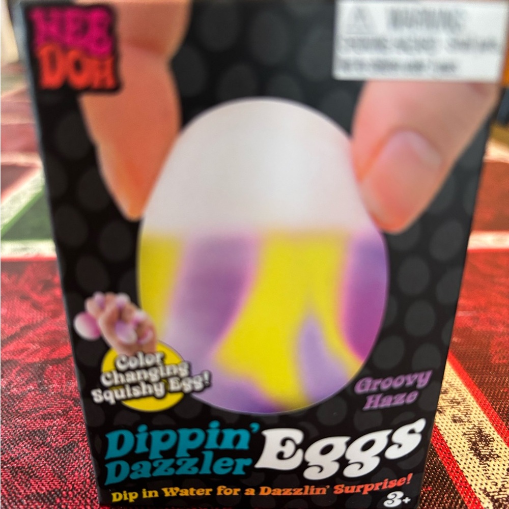 Dippin' Dazzler Eggs Color-Changing Squishy Egg - Groovy Haze
Nee doh